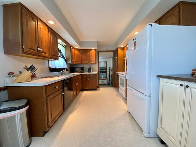 240 Hamburg Rd, Hempfield Twp Mer, PA 16125 - kitchen with recessed lighting, a sink, brown cabinets, and white appliances