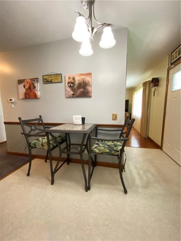 240 Hamburg Rd, Hempfield Twp Mer, PA 16125 - dining space featuring baseboards and a notable chandelier