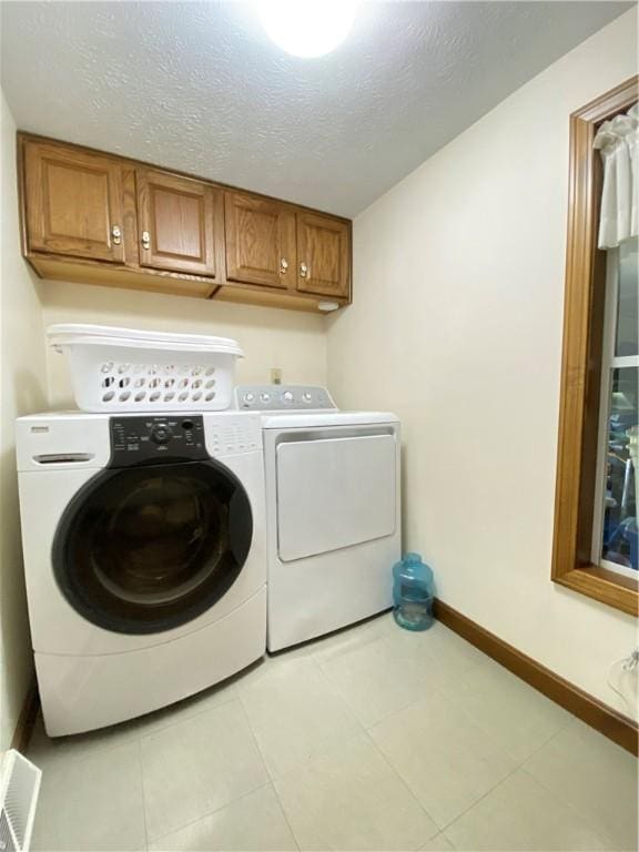 240 Hamburg Rd, Hempfield Twp Mer, PA 16125 - laundry area with visible vents, tile patterned flooring, baseboards, washer and clothes dryer, and cabinet space