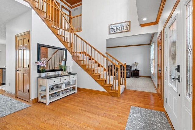 302 Castanea Dr, Cranberry Twp, PA 16066 - entryway with stairs, baseboards, ornamental molding, and wood finished floors