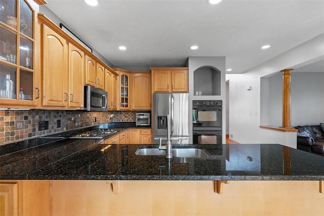 302 Castanea Dr, Cranberry Twp, PA 16066 - kitchen with a peninsula, appliances with stainless steel finishes, tasteful backsplash, and glass insert cabinets