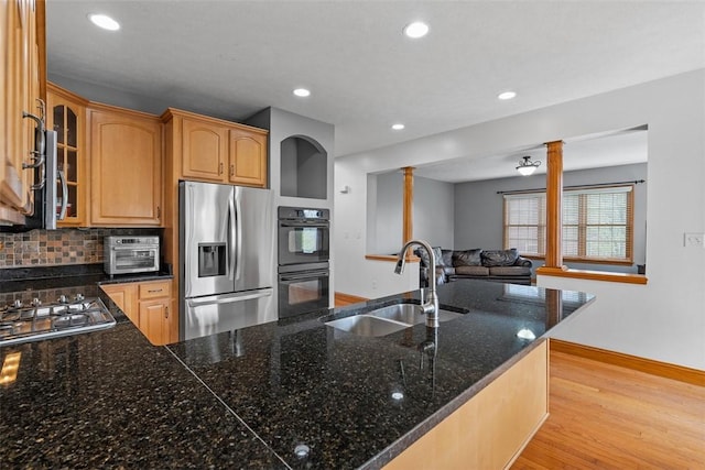 302 Castanea Dr, Cranberry Twp, PA 16066 - kitchen with a sink, stainless steel appliances, baseboards, recessed lighting, and glass insert cabinets