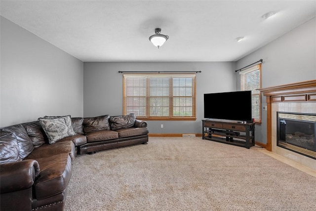 302 Castanea Dr, Cranberry Twp, PA 16066 - living room featuring a tiled fireplace, baseboards, carpet flooring, and visible vents
