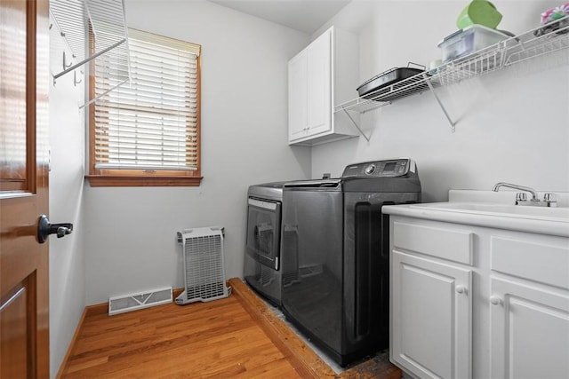 302 Castanea Dr, Cranberry Twp, PA 16066 - washroom featuring cabinet space, washing machine and clothes dryer, light wood-style flooring, baseboards, and visible vents