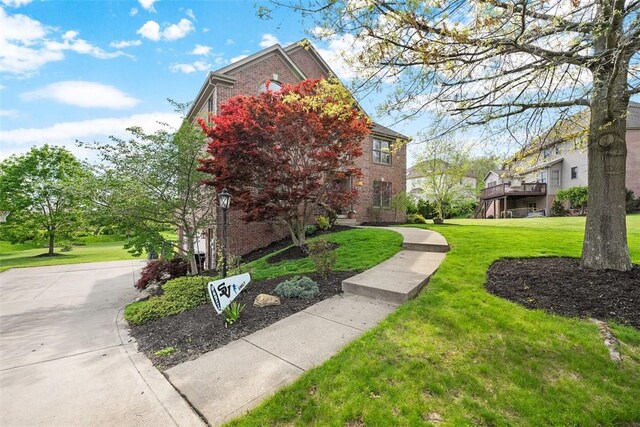 302 Castanea Dr, Cranberry Twp, PA 16066 - view of side of property with brick siding and a yard