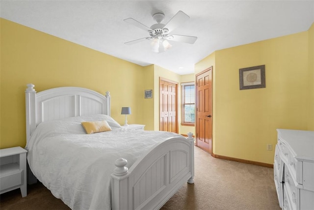302 Castanea Dr, Cranberry Twp, PA 16066 - bedroom with baseboards, multiple closets, light carpet, and ceiling fan