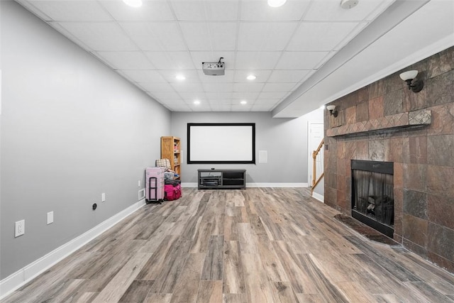302 Castanea Dr, Cranberry Twp, PA 16066 - home theater room featuring visible vents, wood finished floors, baseboards, recessed lighting, and a tile fireplace