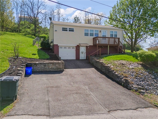 view of front of house with a front lawn, a wooden deck, stairs, aphalt driveway, and an attached garage