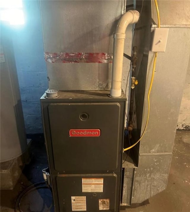 utility room with heating unit