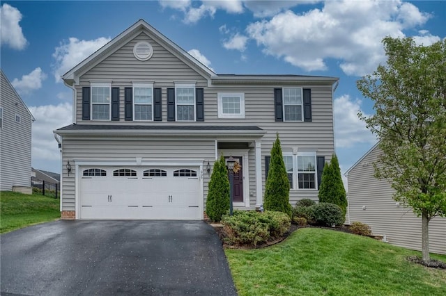 605 Saddle Ct, Moon/Crescent Twp, PA 15108 - traditional-style home featuring a front yard, a garage, and aphalt driveway