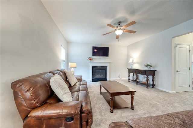 605 Saddle Ct, Moon/Crescent Twp, PA 15108 - living area featuring a glass covered fireplace, a ceiling fan, baseboards, and light carpet