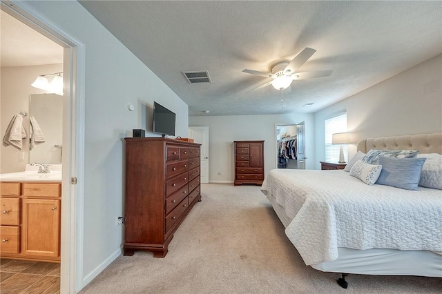 605 Saddle Ct, Moon/Crescent Twp, PA 15108 - bedroom featuring visible vents, ensuite bathroom, a closet, and a walk in closet
