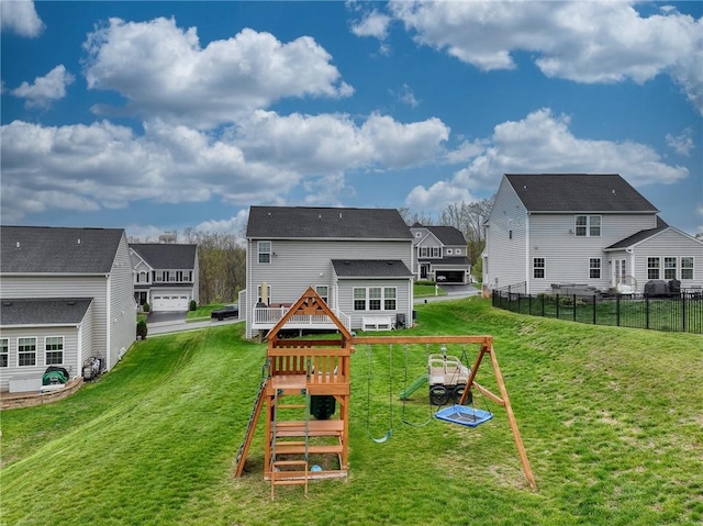 605 Saddle Ct, Moon/Crescent Twp, PA 15108 - back of property featuring fence, a yard, a residential view, and a playground