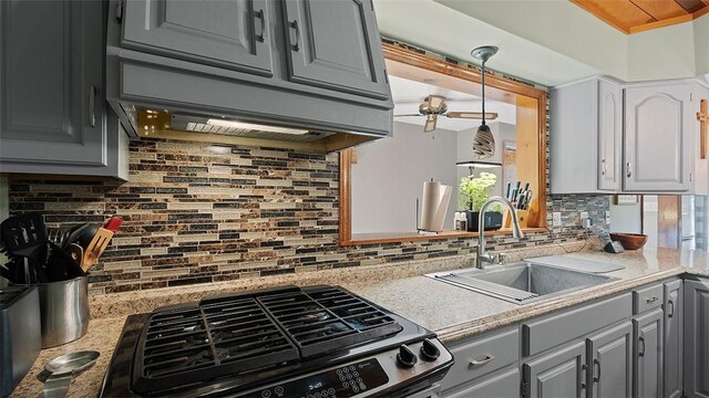 114 Silent Meadow Dr, Washington Twp Wml, PA 15632 - kitchen with a sink, backsplash, stainless steel gas range oven, and gray cabinetry
