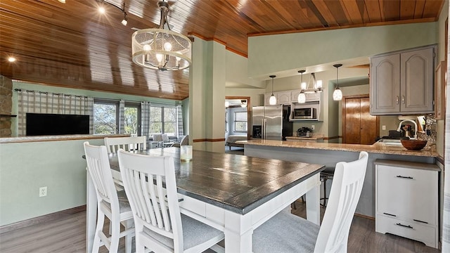114 Silent Meadow Dr, Washington Twp Wml, PA 15632 - dining room featuring wood ceiling, vaulted ceiling, wood finished floors, baseboards, and an inviting chandelier