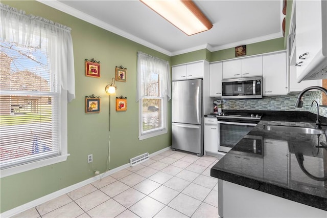 kitchen with visible vents, a healthy amount of sunlight, appliances with stainless steel finishes, and a sink