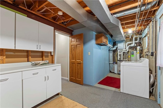 below grade area with gas water heater, separate washer and dryer, and light carpet