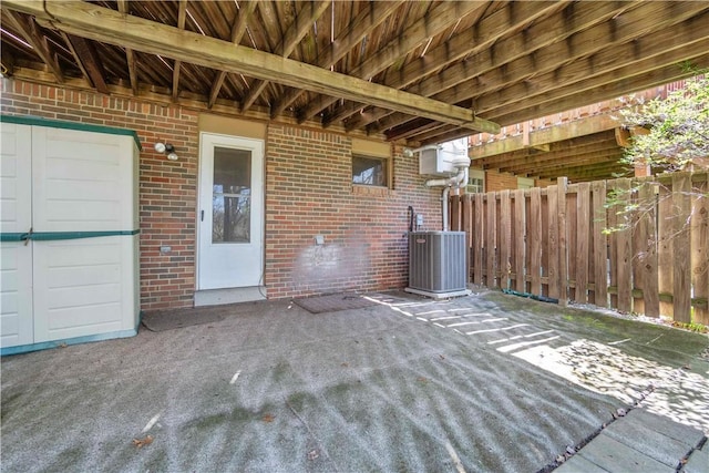 view of patio featuring cooling unit and fence