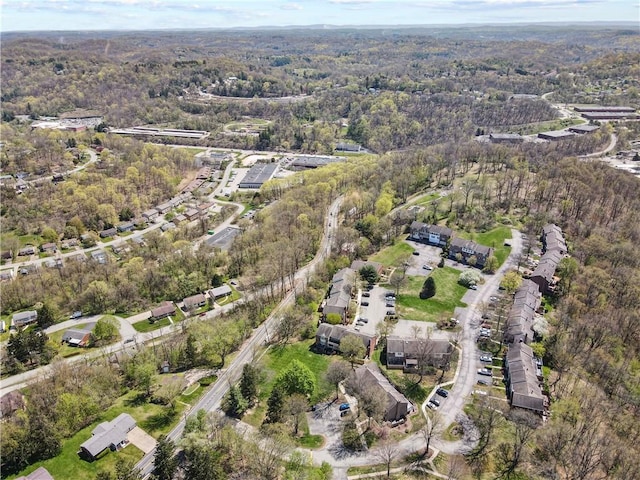 birds eye view of property with a wooded view