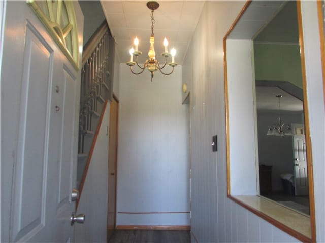 interior space featuring an inviting chandelier and baseboards