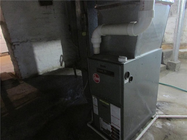 utility room with heating unit