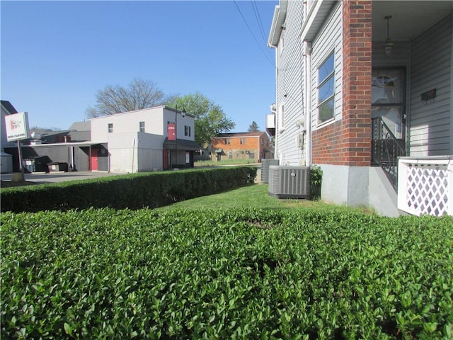 view of yard with central air condition unit