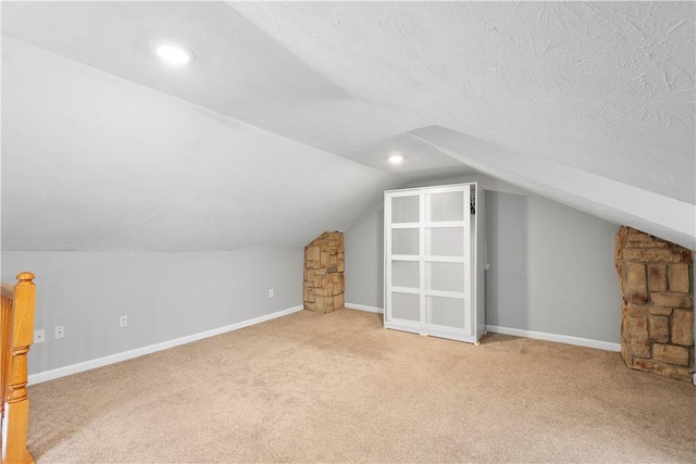 2113 Wharton St, South Side, PA 15203 - bonus room featuring baseboards, a textured ceiling, lofted ceiling, and carpet