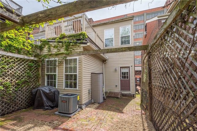 2113 Wharton St, South Side, PA 15203 - rear view of house featuring central AC unit, a balcony, and a patio area