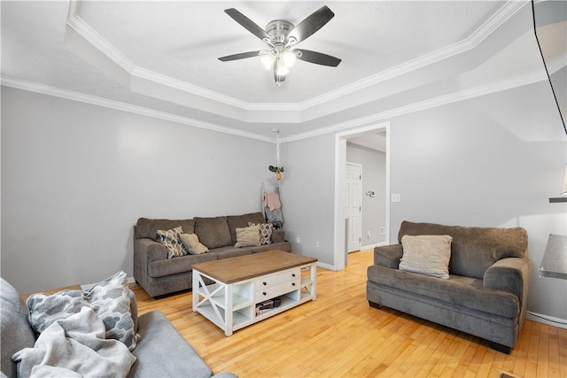 2113 Wharton St, South Side, PA 15203 - living room with a tray ceiling, a ceiling fan, light wood-style flooring, baseboards, and ornamental molding