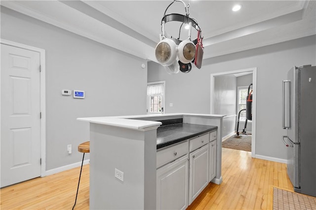 2113 Wharton St, South Side, PA 15203 - kitchen with light wood-style flooring, freestanding refrigerator, and baseboards