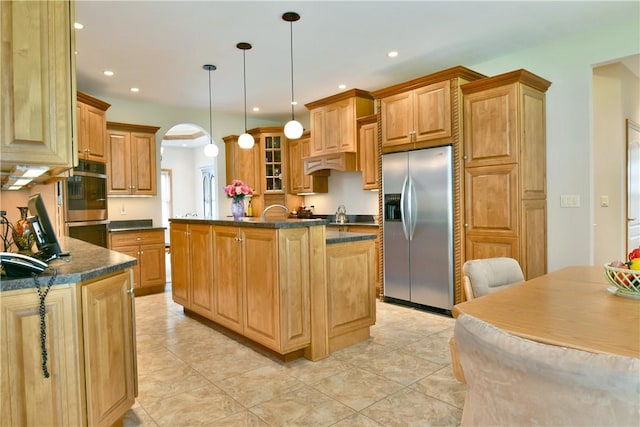 3461 Silver Ridge Ct, Hermitage, PA 16148 - kitchen with recessed lighting, arched walkways, stainless steel appliances, dark countertops, and a center island