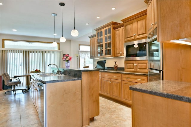 3461 Silver Ridge Ct, Hermitage, PA 16148 - kitchen featuring a sink, light tile patterned floors, glass insert cabinets, a center island with sink, and appliances with stainless steel finishes