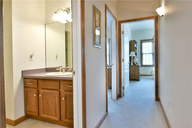 3461 Silver Ridge Ct, Hermitage, PA 16148 - hallway with baseboards, light colored carpet, and a sink