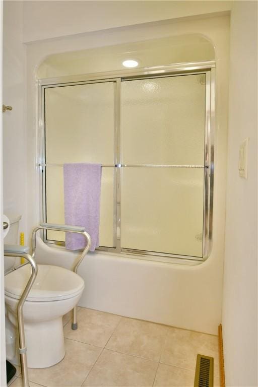 3461 Silver Ridge Ct, Hermitage, PA 16148 - bathroom featuring enclosed tub / shower combo, toilet, visible vents, and tile patterned flooring