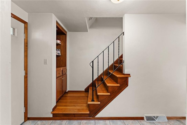 227 Gass Rd, Ross Twp, PA 15229 - stairway featuring visible vents, tile patterned floors, and baseboards