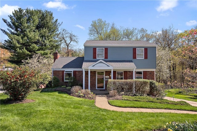 227 Gass Rd, Ross Twp, PA 15229 - view of front of property with a front lawn, a chimney, a shingled roof, and brick siding