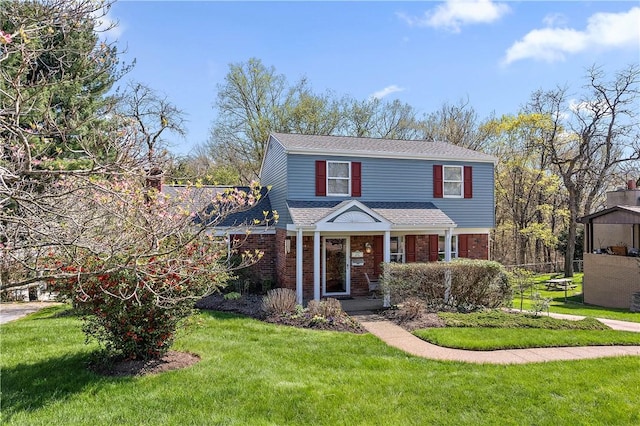 227 Gass Rd, Ross Twp, PA 15229 - traditional-style home with roof with shingles, a front yard, and brick siding