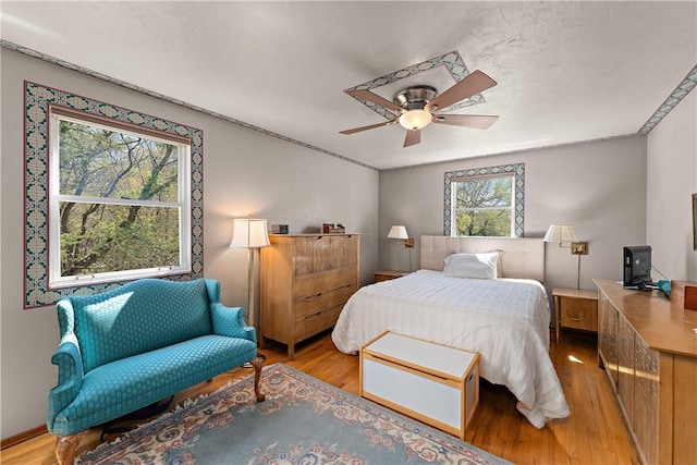 227 Gass Rd, Ross Twp, PA 15229 - bedroom featuring multiple windows, ceiling fan, and light wood-style flooring