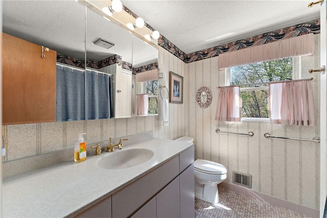 227 Gass Rd, Ross Twp, PA 15229 - bathroom featuring tile patterned flooring, toilet, vanity, visible vents, and a textured ceiling
