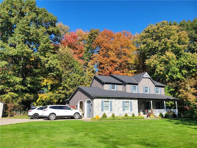 15 Willow Ln, Pine Twp Mer, PA 16127 - view of front of home featuring a porch, a front yard, stone siding, and driveway