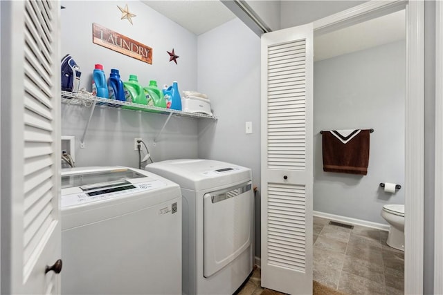 112 Aprilmae Way, Ross Twp, PA 15237 - laundry room with laundry area, separate washer and dryer, baseboards, stone finish flooring, and visible vents