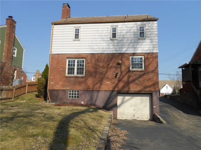 552 Crestline Dr, Baldwin Twp, PA 15234 - back of house with fence, brick siding, a garage, a yard, and driveway