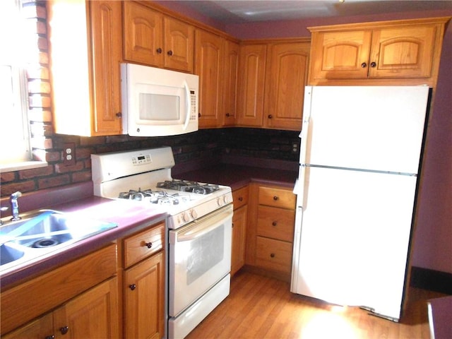 552 Crestline Dr, Baldwin Twp, PA 15234 - kitchen featuring white appliances, decorative backsplash, a sink, and light wood-style floors