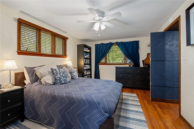 bedroom featuring ceiling fan and wood finished floors