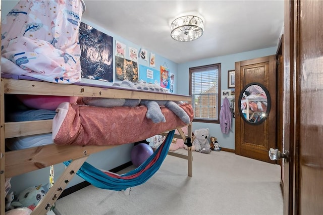 carpeted bedroom with baseboards