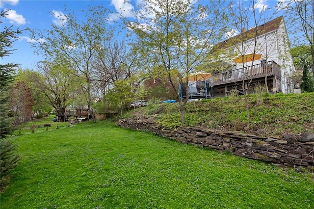 view of yard with a wooden deck
