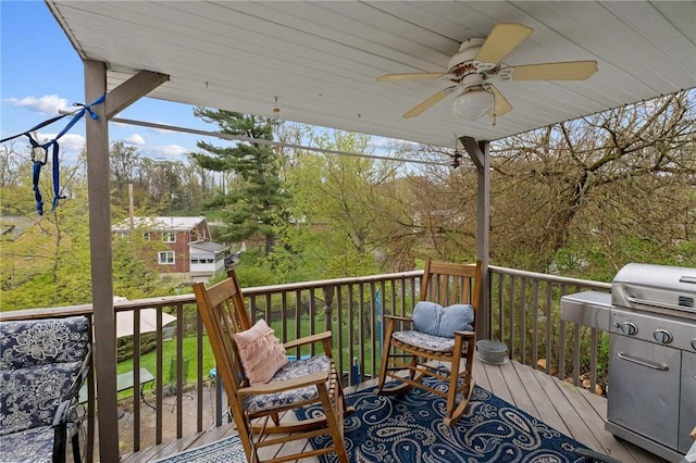 wooden terrace featuring ceiling fan