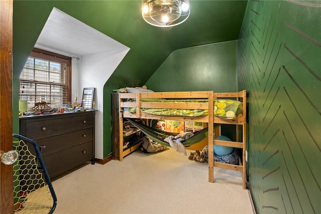carpeted bedroom with vaulted ceiling
