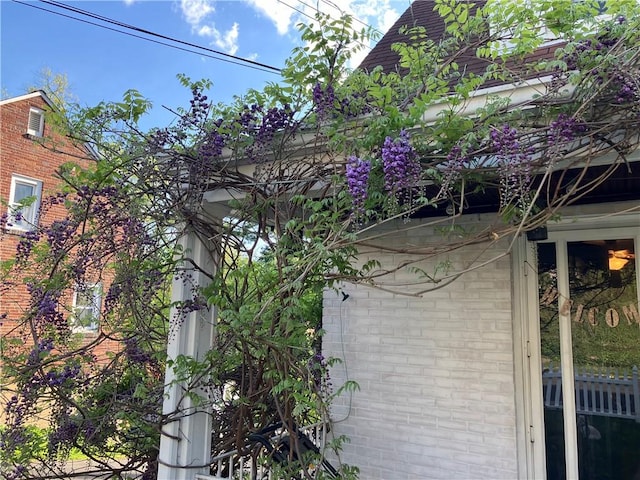 view of side of property with brick siding