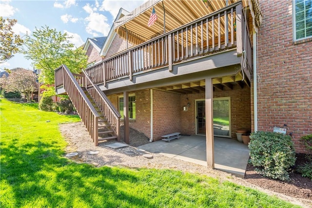 205 Prestonwood Ln, Peters Twp, PA 15317 - rear view of property featuring a wooden deck, a patio area, stairway, brick siding, and a yard